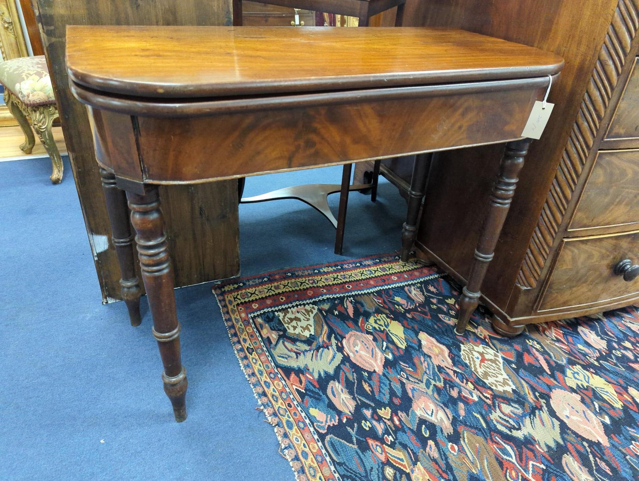 A Regency mahogany D shaped folding tea table, width 91cm, depth 46cm, height 74cm